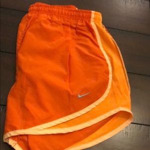 Like new orange Nike tempo shorts